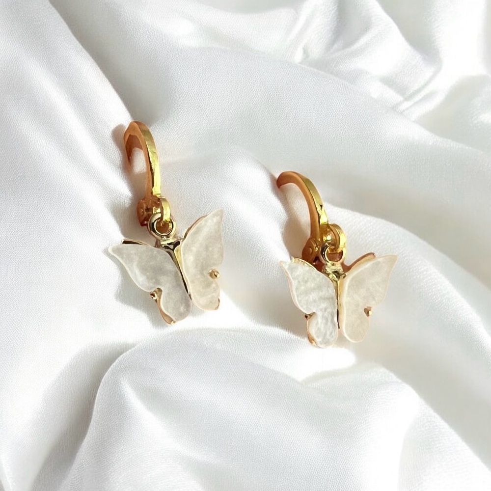 white butterfly huggie hoop earrings